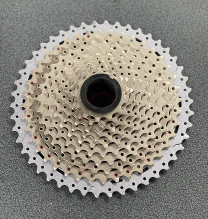 Pacco pignoni cassetta MTB 11V x 11/46 denti in alluminio argento corpetto Shimano